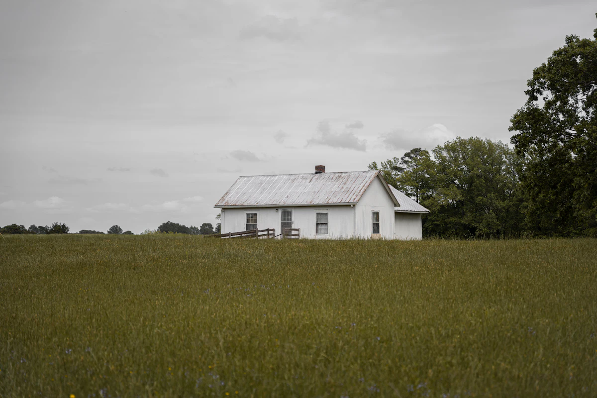 A code-free owner-built farmhouse on open rural acreage